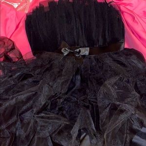 A   Bow front layered black mesh tube dress.
